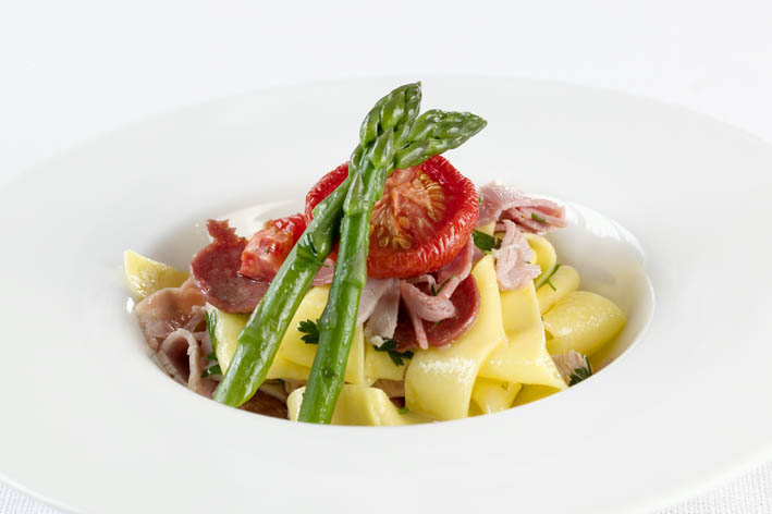 Sliced Oven Baked Ham & Cacciatori, with fresh fettucine, Grana Padano parmesan, asparagus & tomato, drizzled with extra virgin olive oil