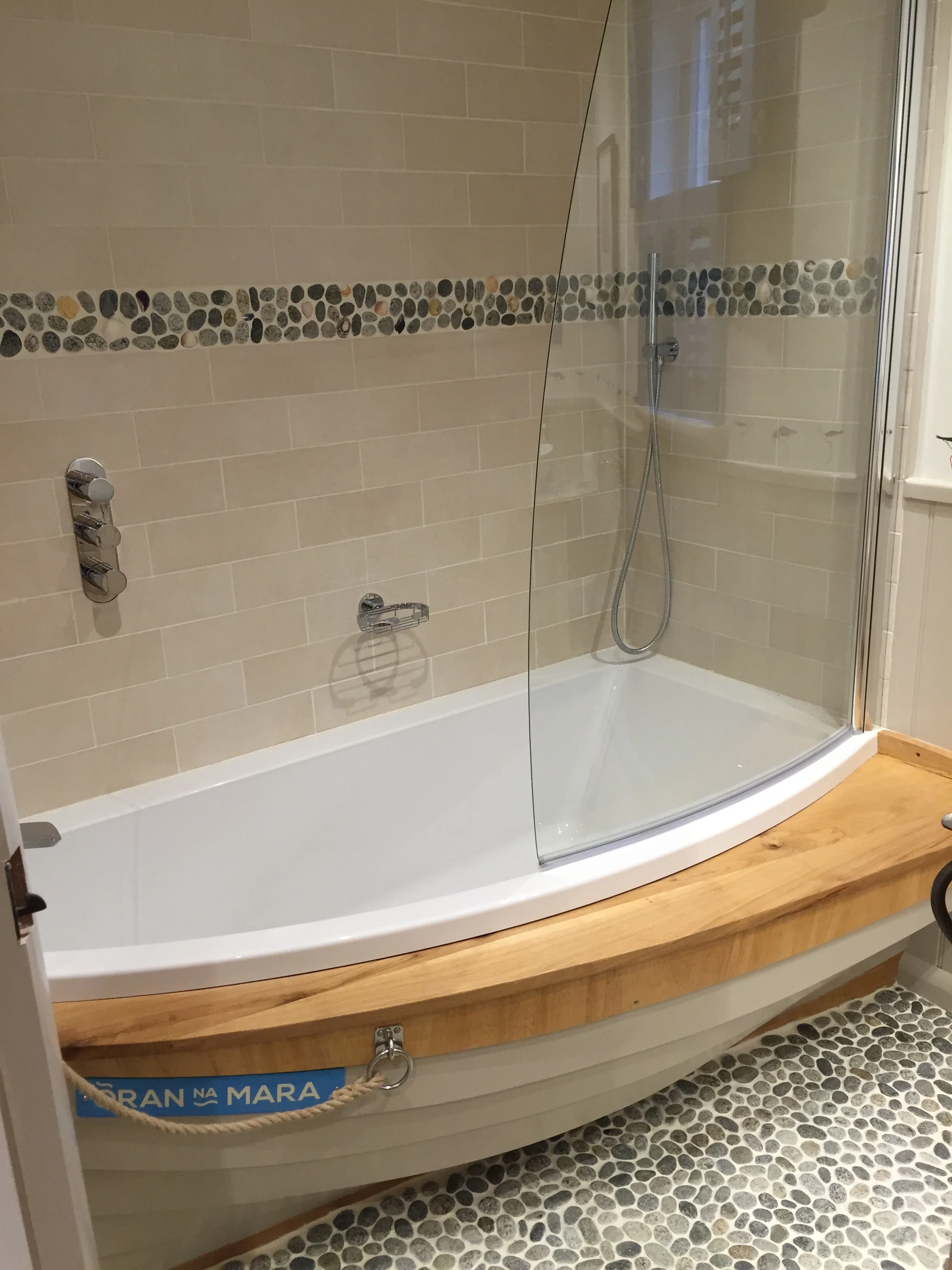 The bath surround was created by a boat builder from the islands