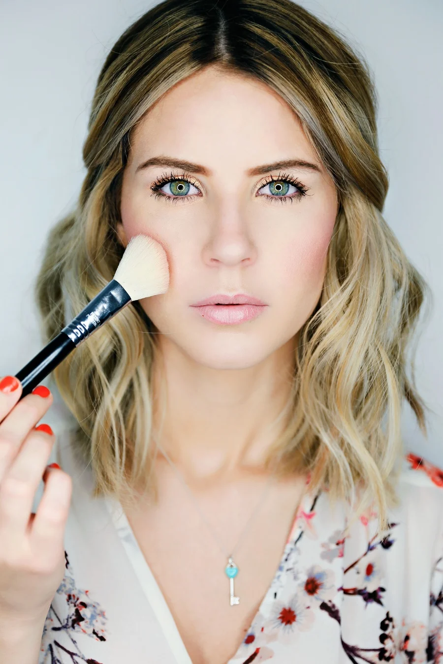 Take a Sigma F40 brush and apply your blush to the apples of your cheeks, blending it into the bronzer. Again, I'm all about peach tones so my go to blush lately is Style by Mac. It has a very slight shimmer to it to really help make your skin look glowing.