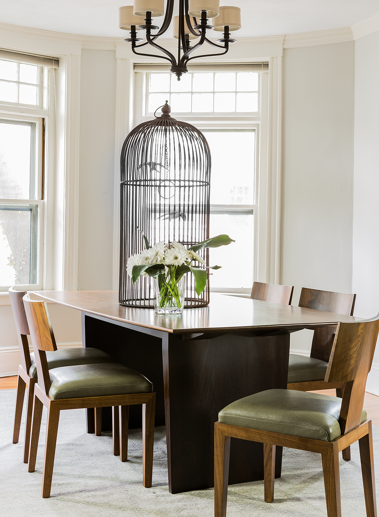 Danish Modern Table with sequenced walnut slabs and stained mahogany base and the Half Crown Chair.