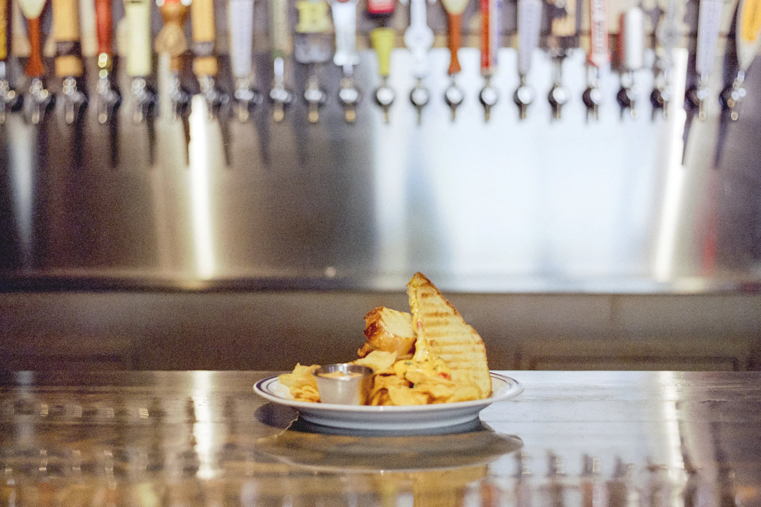 GRILLED PIMENTO CHEESE | aged sharp cheddar & goat cheese. roasted red peppers, fresh thyme, chips & smoked chili aioli
