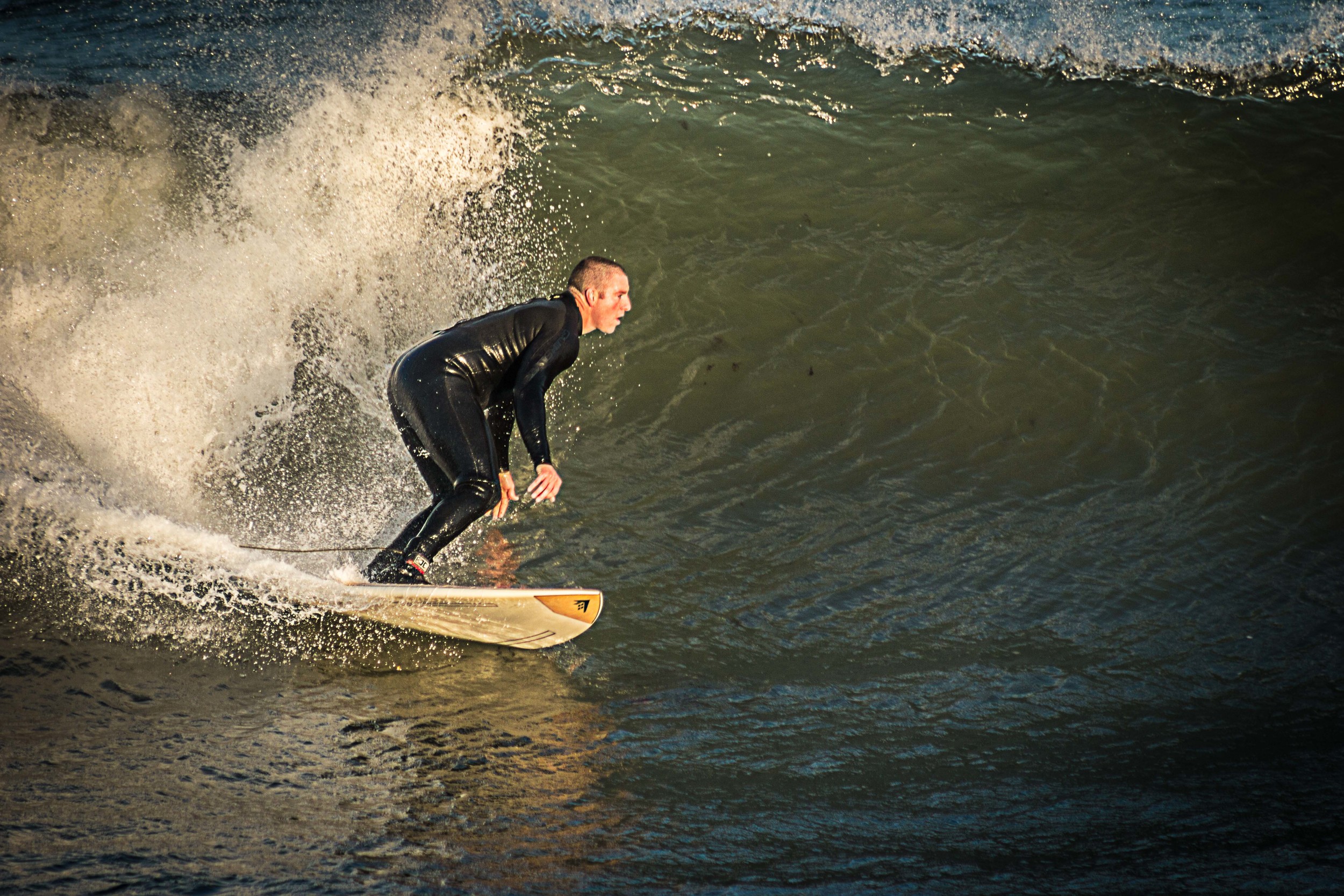 Surfer drops in