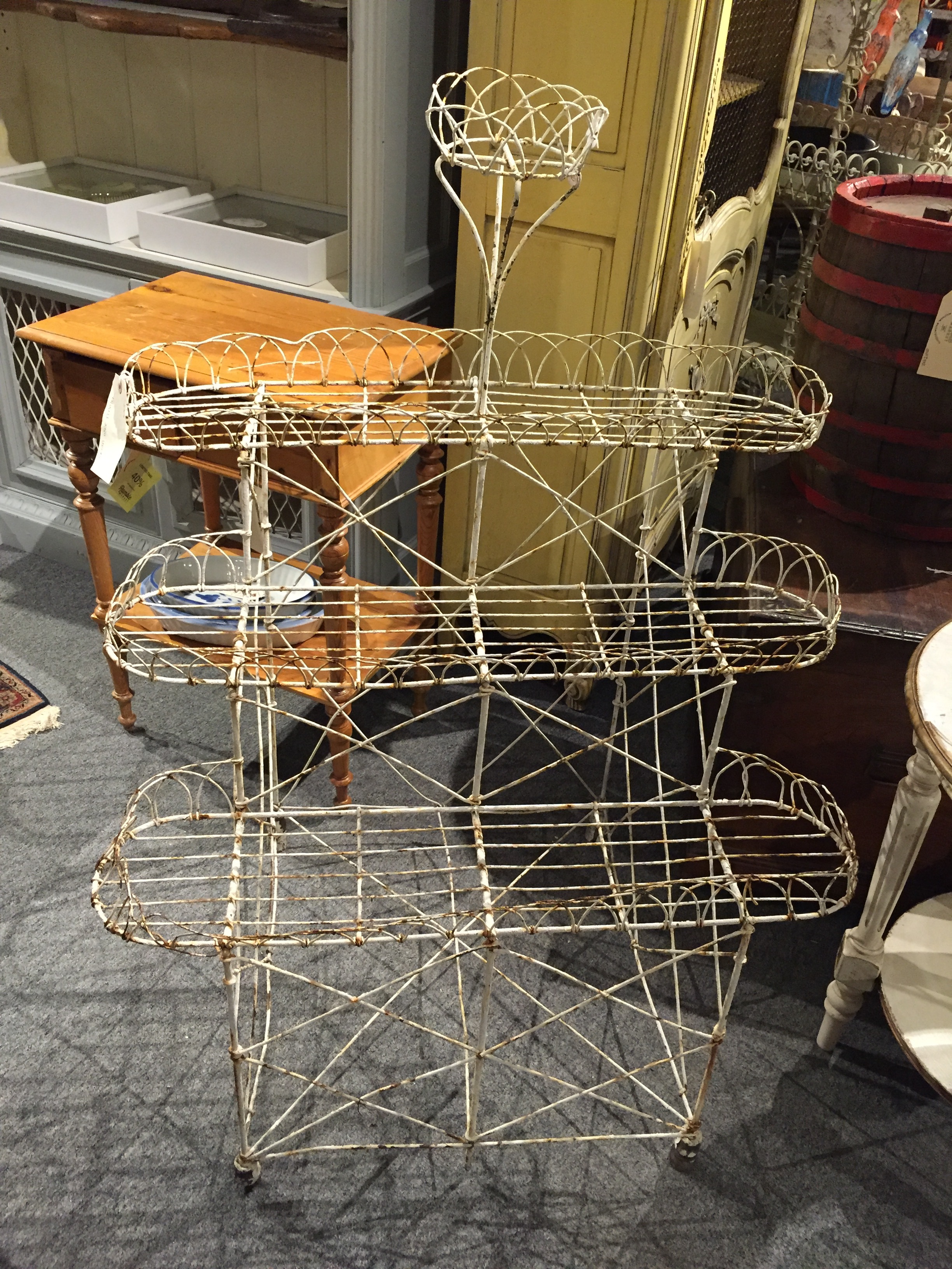 I saw a plant stand like this at a photo shoot I was at a few years back at a tony estate in Westchester. How fun would this be with potted herbs in matching terra-cotta pots?