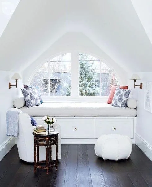 I would love to cozy up with a good book and blanket here. I'd add a rug though to make it feel a bit warmer. Image via: Pinterest