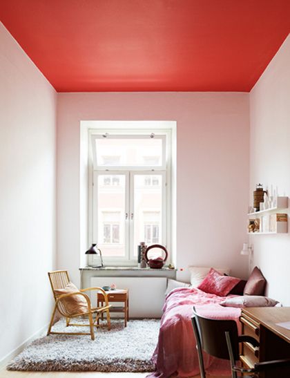 This room is much more contemporary than the last. The red ceiling is another bold and adventurous color choice for this otherwise white box. Image via Design is Mine