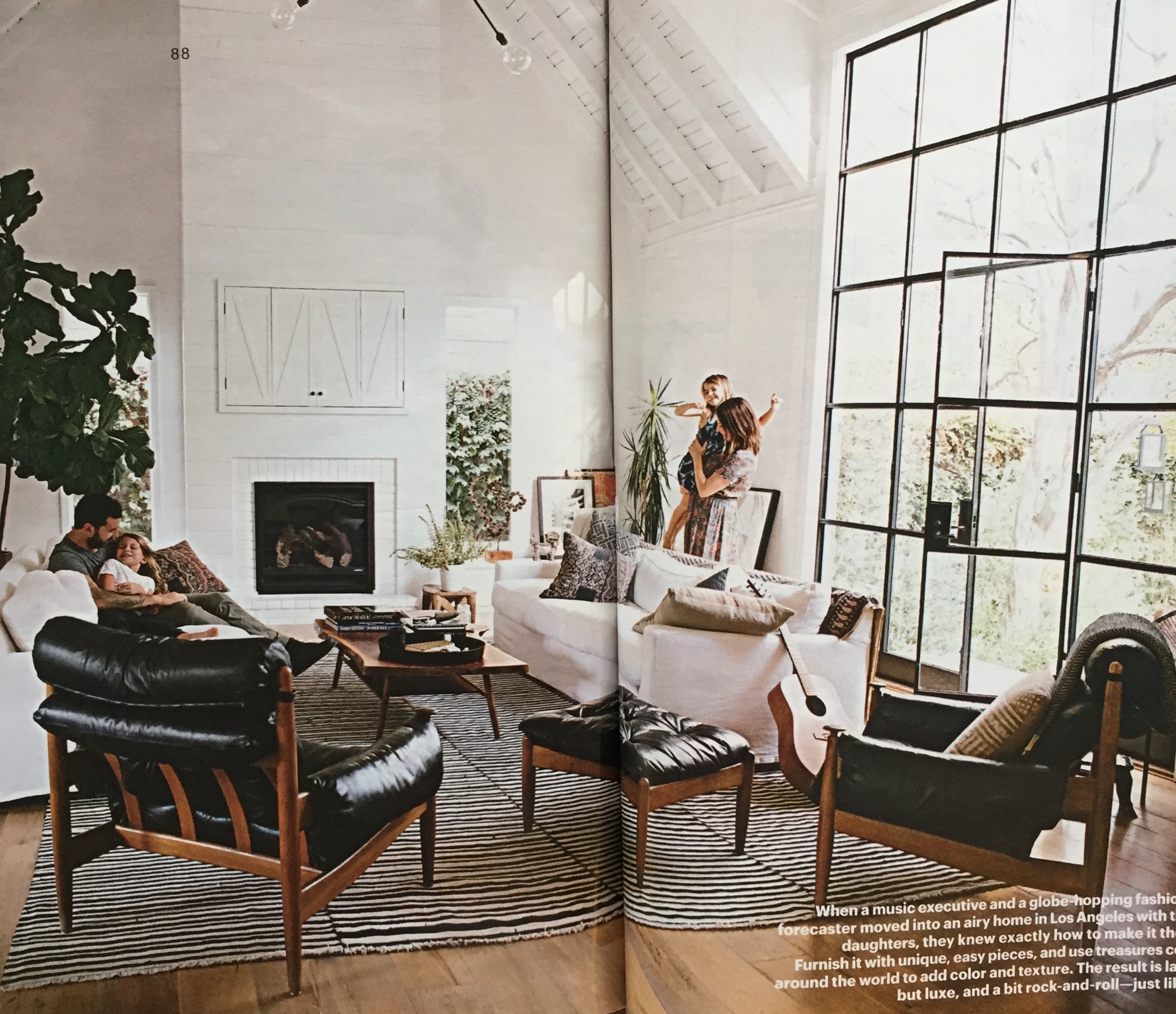 This is the photo in the opening spread. The vintage leather chairs bring that edginess to the room while the sofas and pillows are more bohemian. I love the rug too! Compare this to the photo in Amber's portfolio here and you'll see how different a room can feel just by showing it more "lived in".