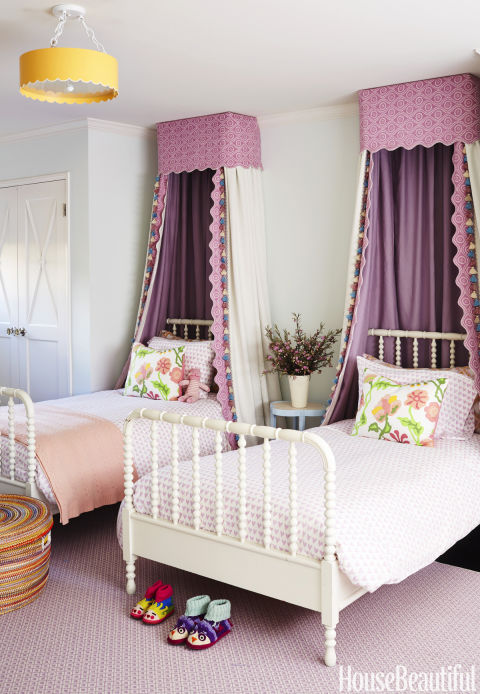 How sweet is this little girls room? The canopies and the coverlets made from Raoul Textiles are beautiful but not too fussy together. And I love the double twin bed look - perfect for sleepovers. Image via House Beautiful .