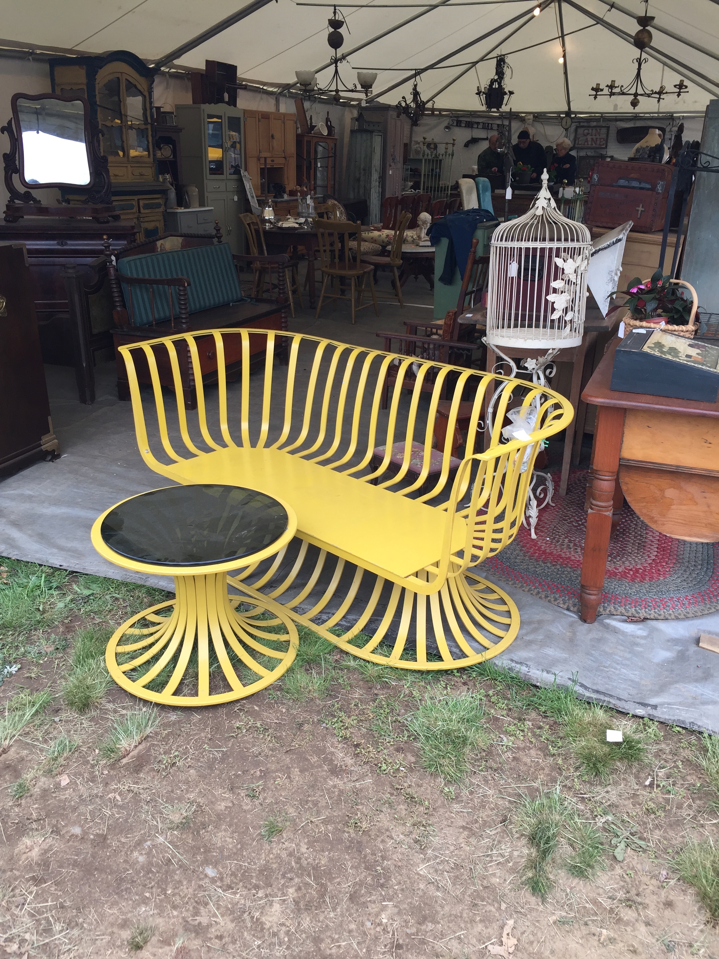 This metal seat and table was super cool - I could see using this on a three season porch or in a garden with a funky patterned cushion.