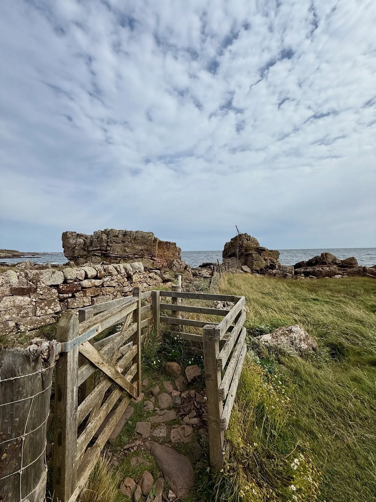 There&rsquo;s a stone wall at the edge of a field near Crail, built long ago without mortar, each rock resting on the next as if they&rsquo;d agreed to hold together. In the middle, a narrow gate &mdash; just wide enough for one person at a time.

Wh
