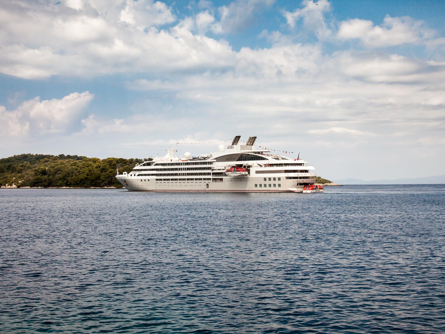 Le Lyrial anchored off Pomena [from sea wall]