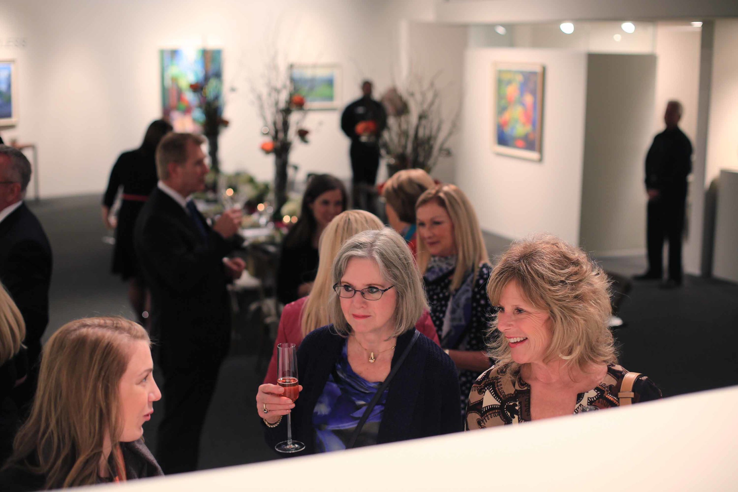 Sipping cocktails, guests were invited to explore the gallery.