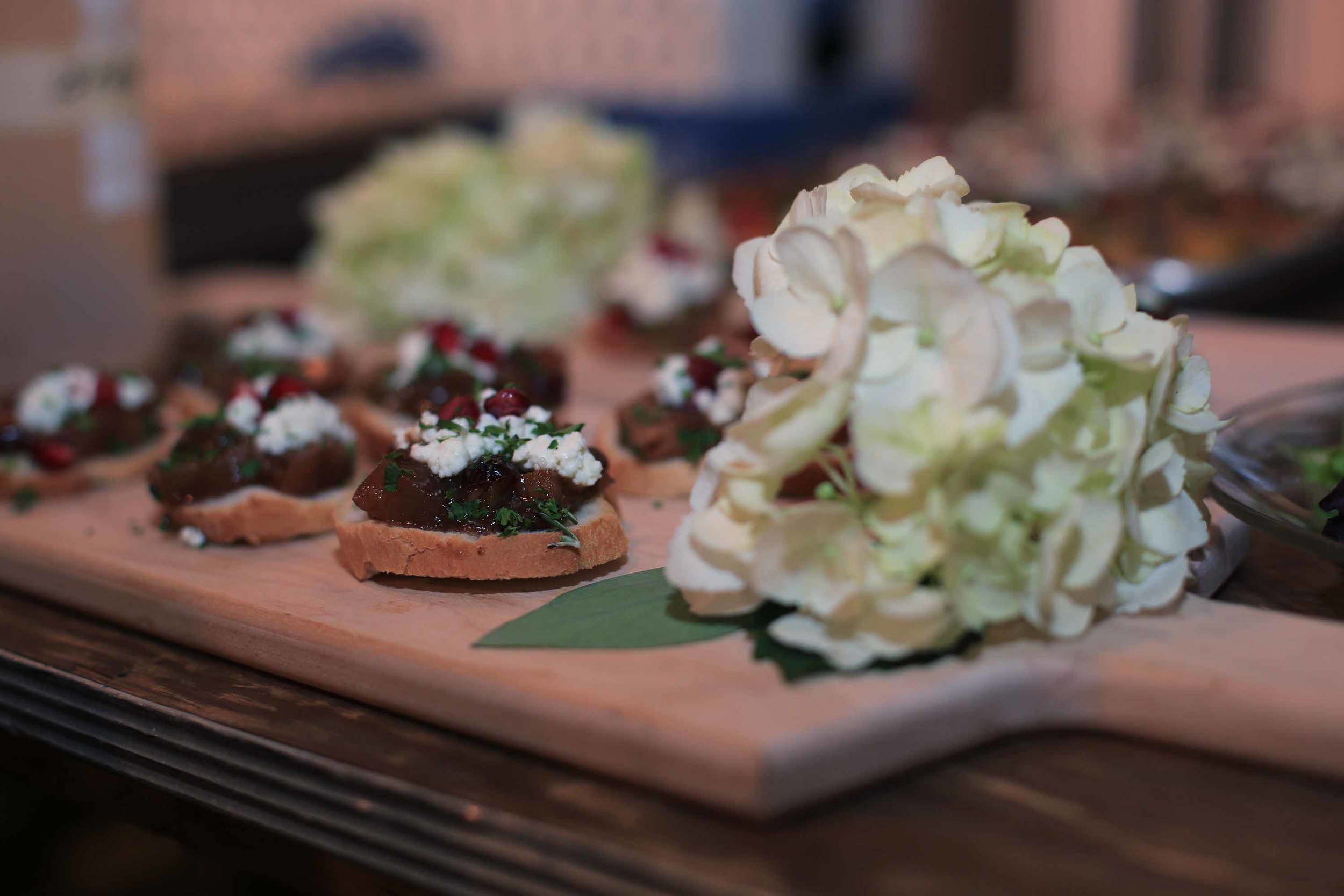 The crostini hors d'oeuvres with pomegranate, apple chutney and goat cheese.