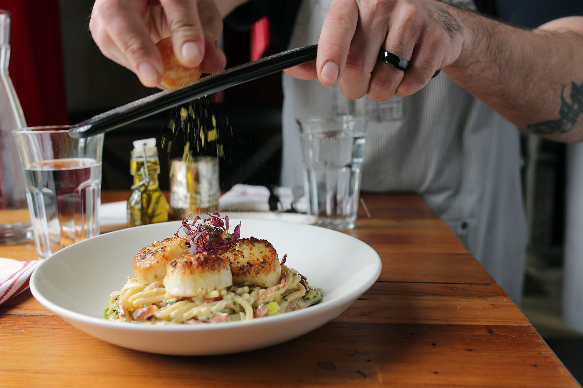 spaghetti di pepe: scallops, guanciale + prosciutto, cured duck egg yolk, parmesan cream, leeks