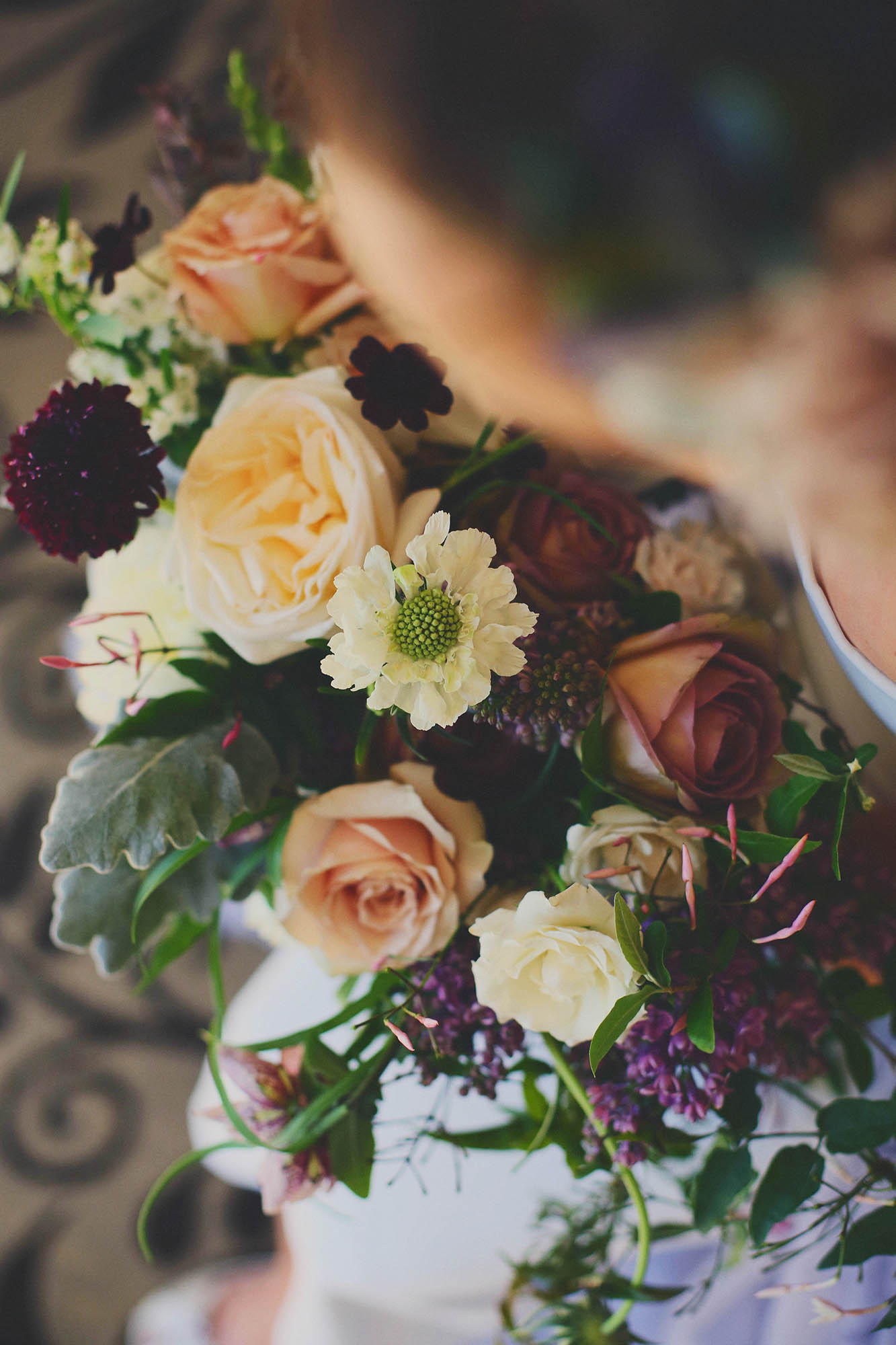a beautiful bouquet by Deedie Springer behind Springvine Design