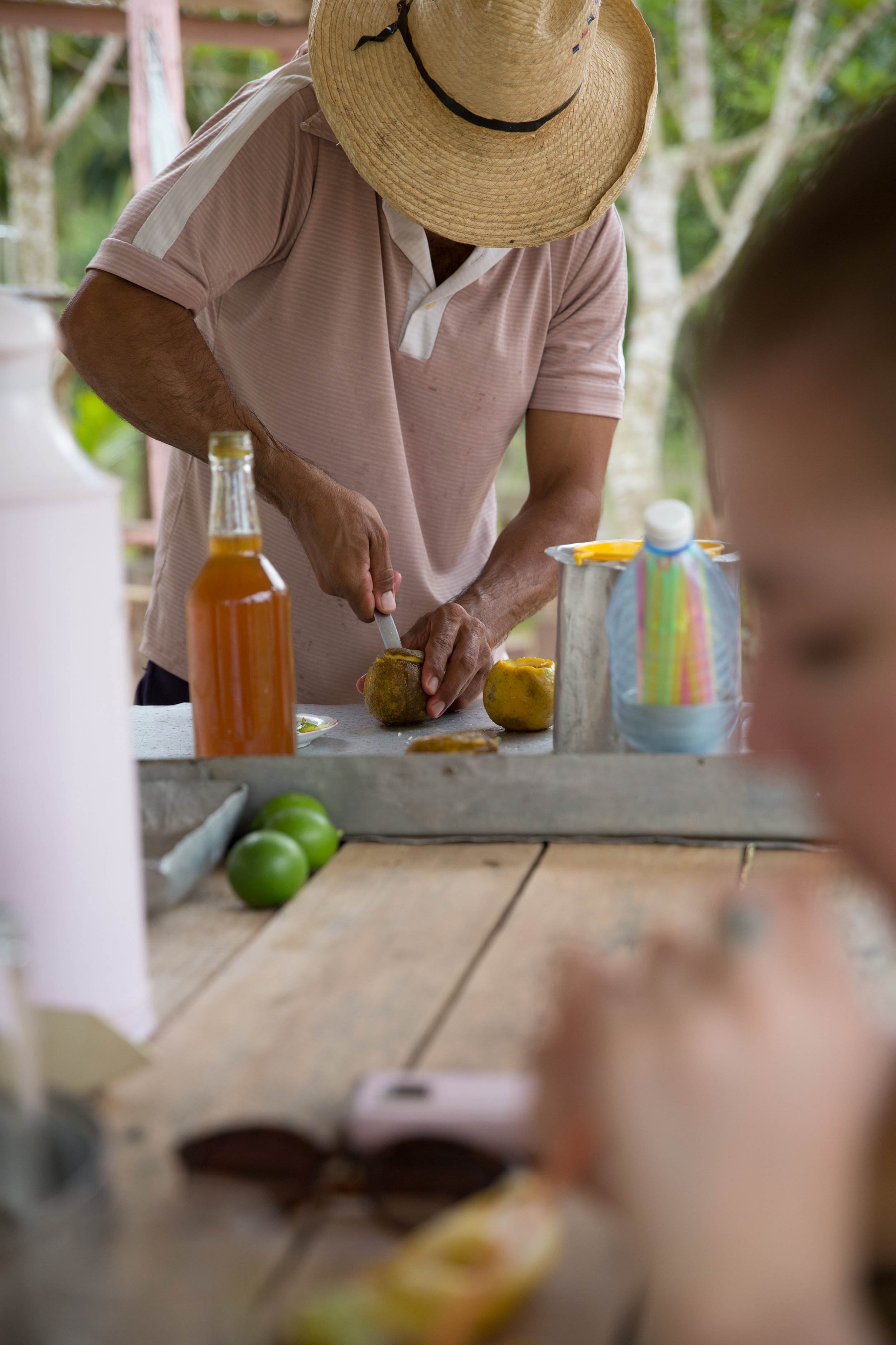 A lemon being cut for open before making the afternoon summer sipper of your dreams.
