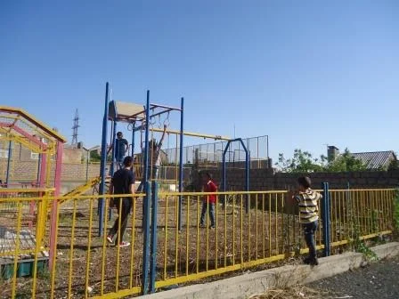The Tomassian children playing in a playground in Yerevan