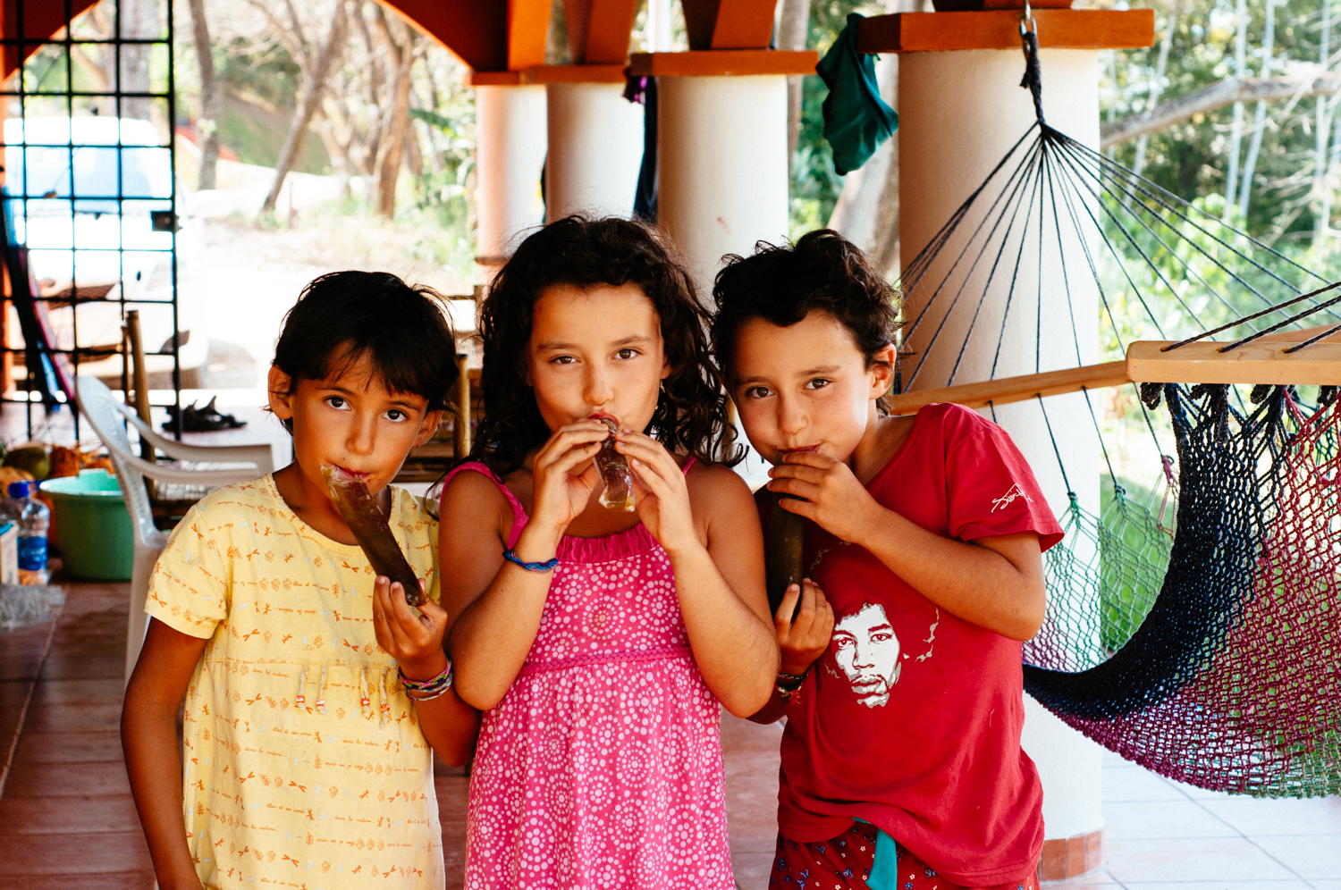 Eating frozen cane sugar popsicles at home, Costa Rica