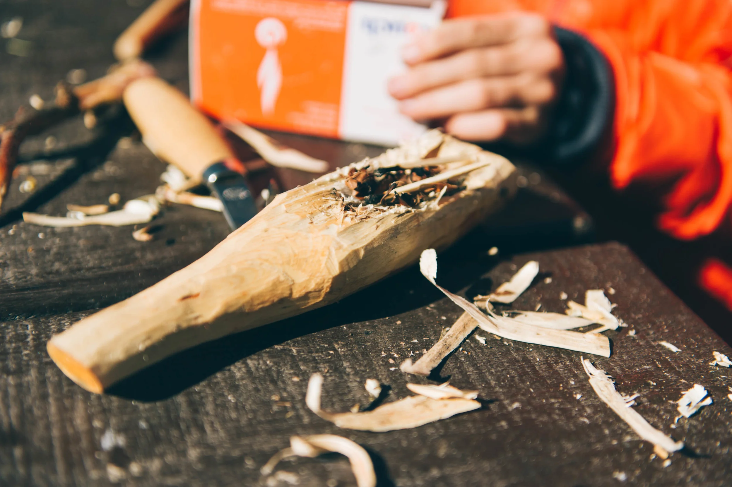 The kids spent many hours carving spoons around the fire. They have to burn the center to make it hollow.