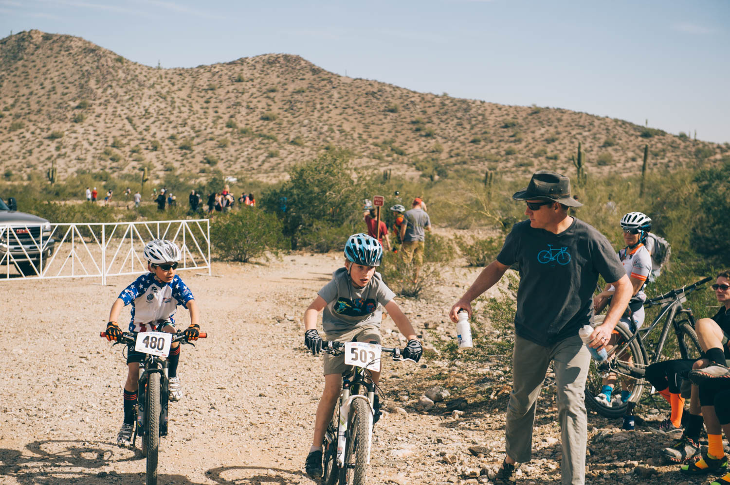 Diedra and Jason's sons were also racing. Jason was their support for the race. Here he is offering water to Charlie.