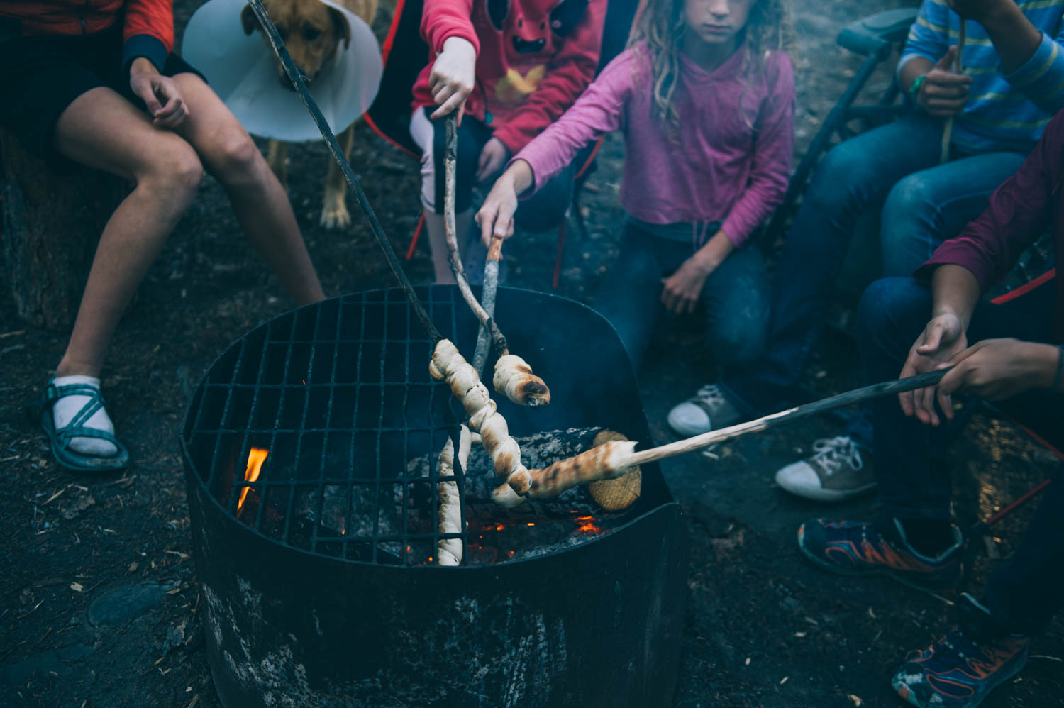 Cooking bannock over the fire.