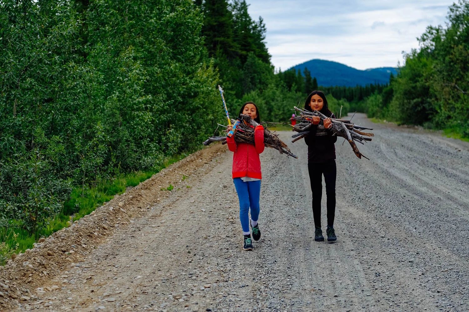 Collecting wood to cook bannock over the fire.