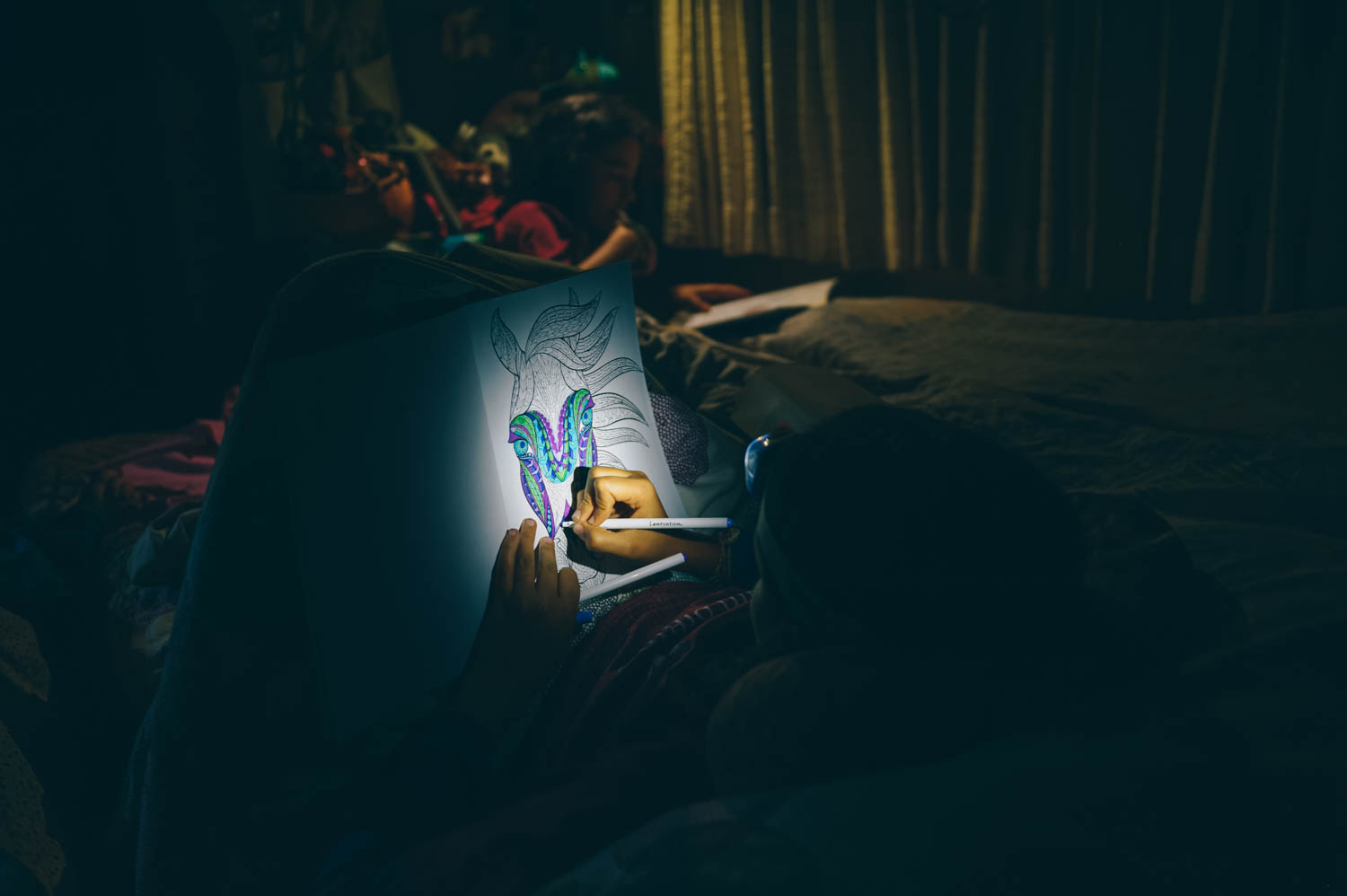 Coloring at night in the bus.