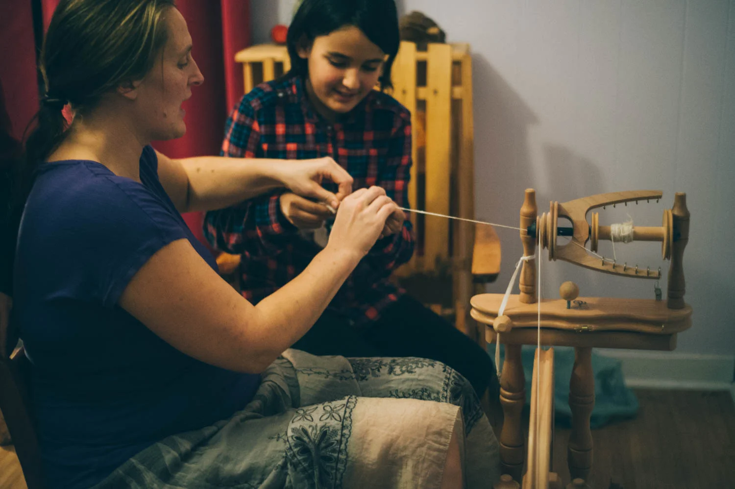 Learning to spin angora rabbit wool.