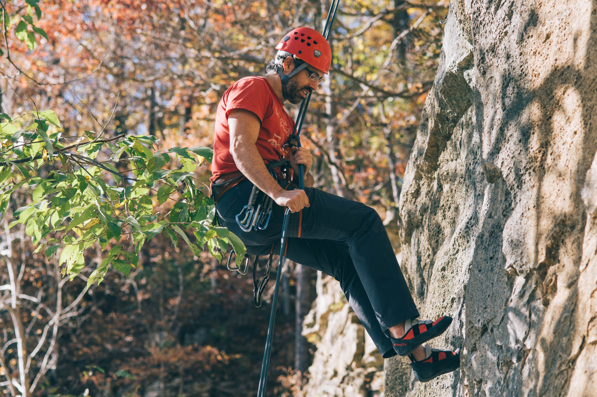 Rappelling down.