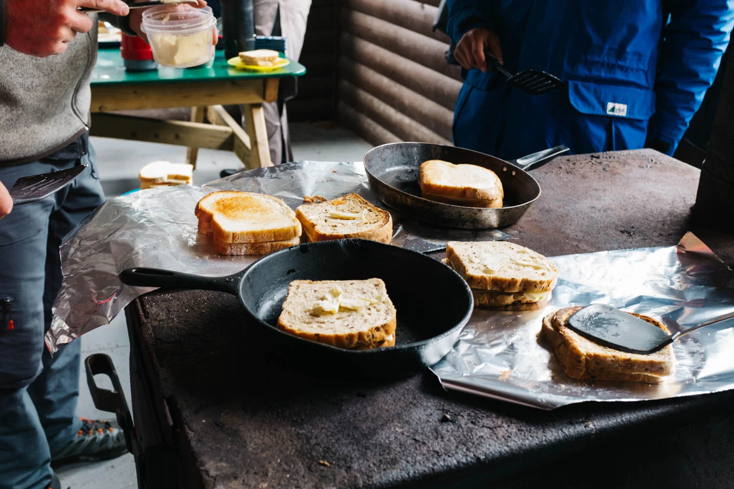 Cooking grilled cheese for 25 on the stove.