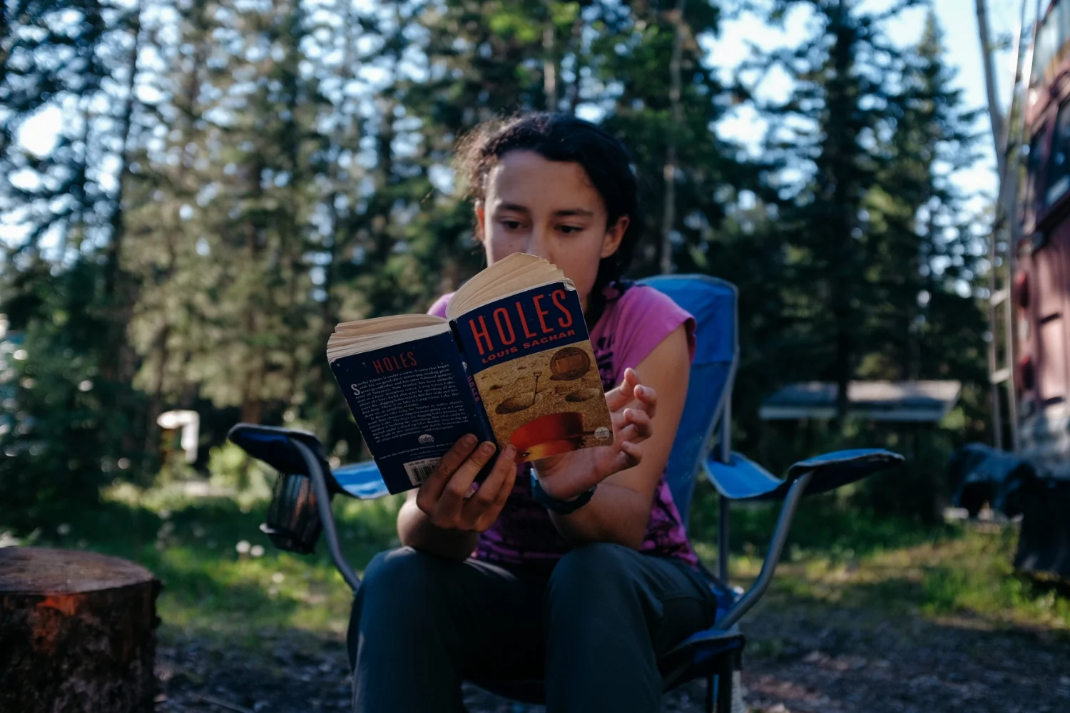 Reading aloud around the bonfire.