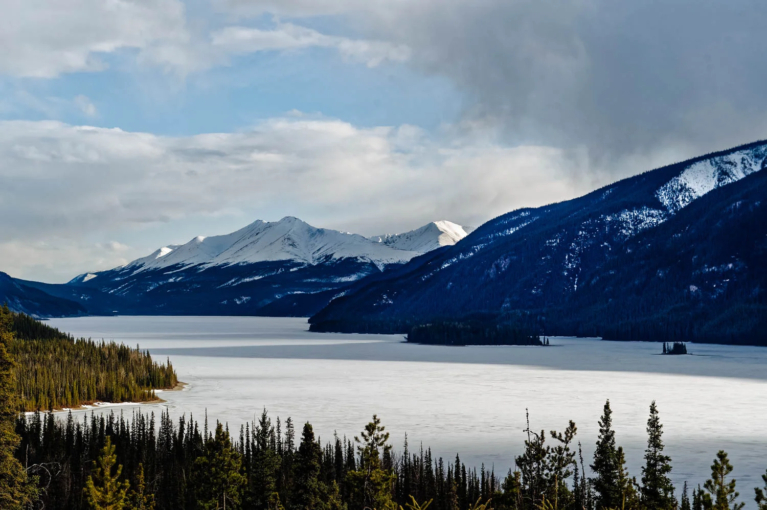 Muncho Lake, usually turquoise, was still frozen.