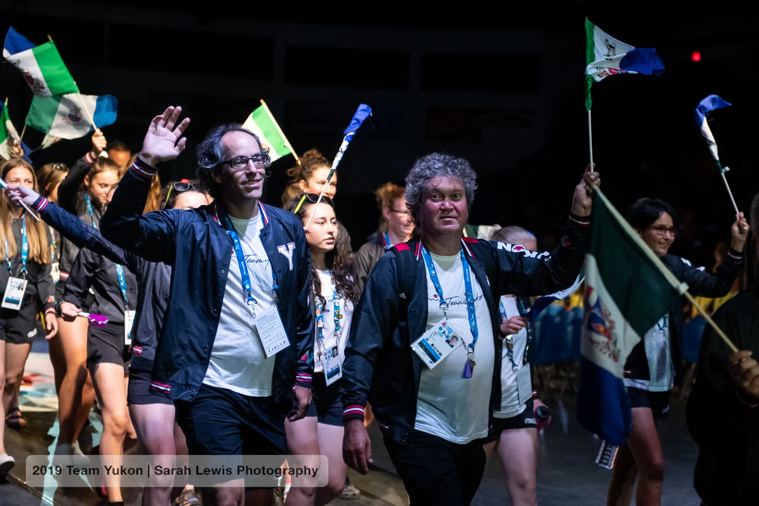 JF and Dean the mechanic (with Aïsha behind him and Mathilde at the far right) entering the arena with the Yukon delegation during the opening ceremonies.