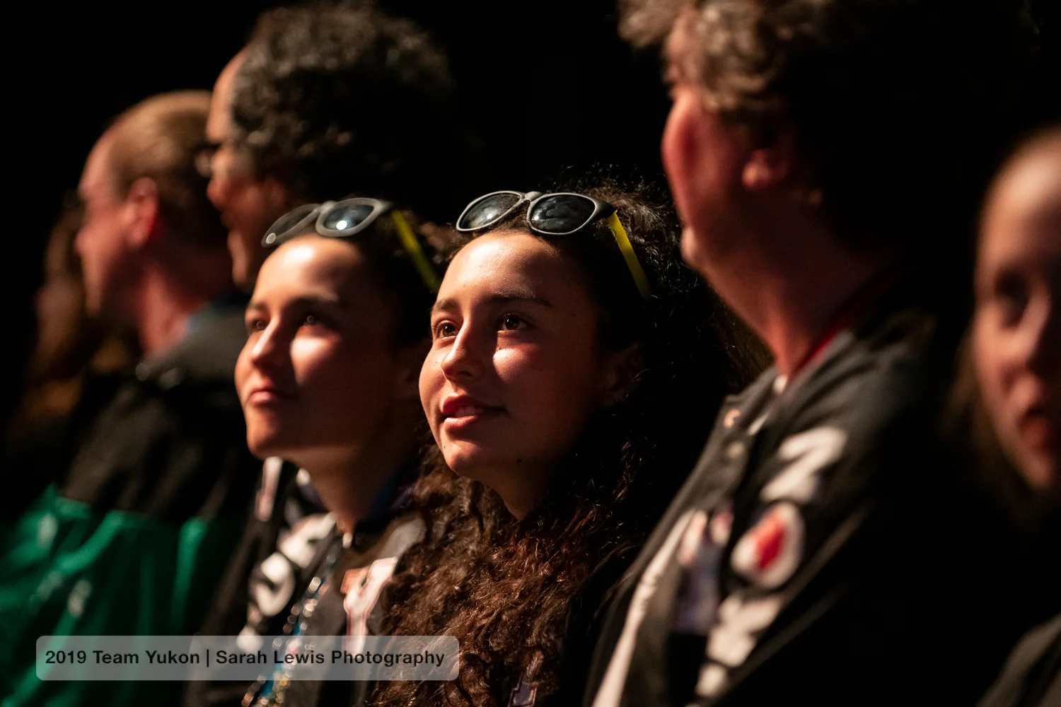 Watching the performers during the ceremonies.