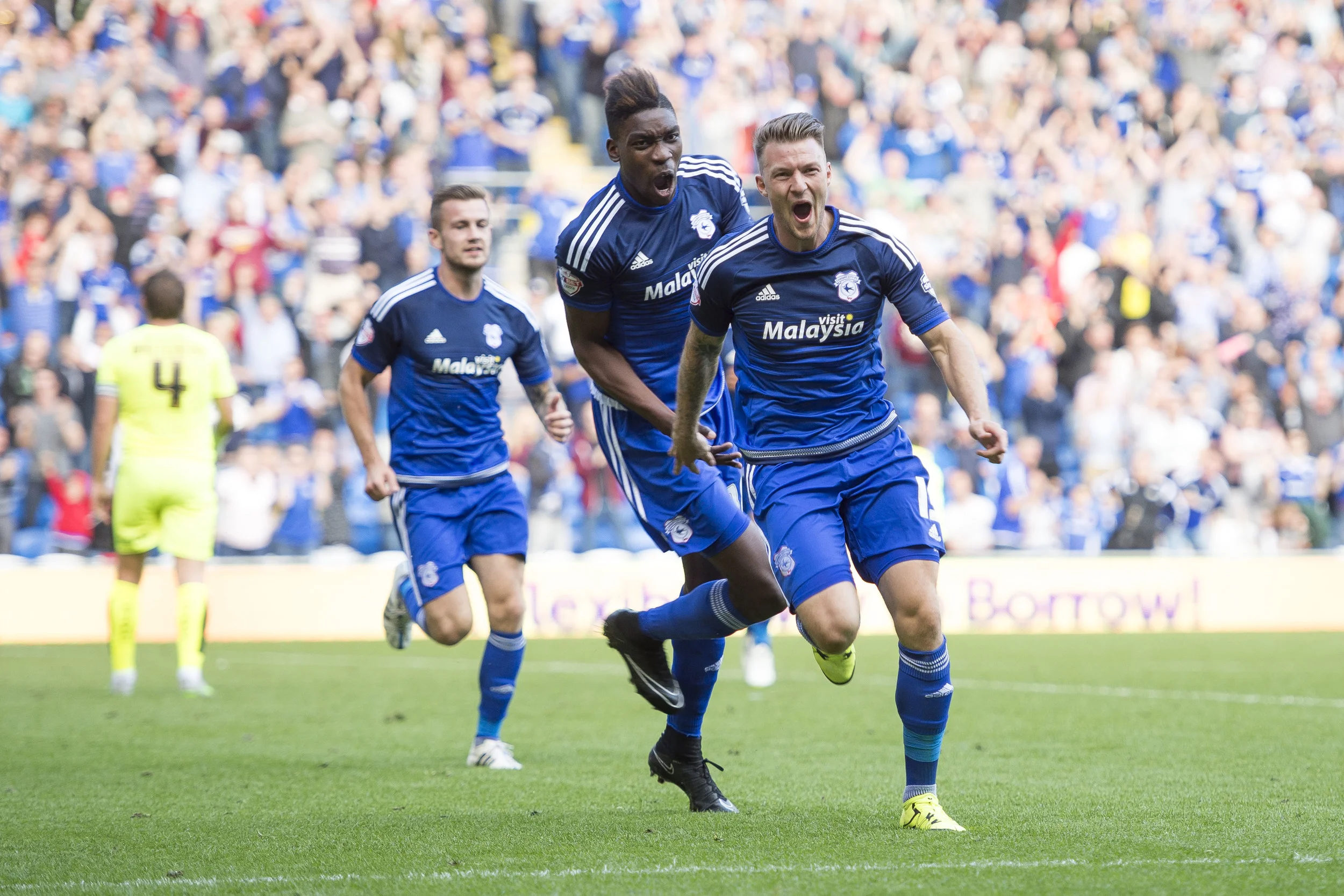 Cardiff City v Huddersfield at the Cardiff City Stadium. Anthony Pilkington (front) celebrates after scoring a goal for Cardiff. (Photo by Matthew Horwood/Wales News Service)