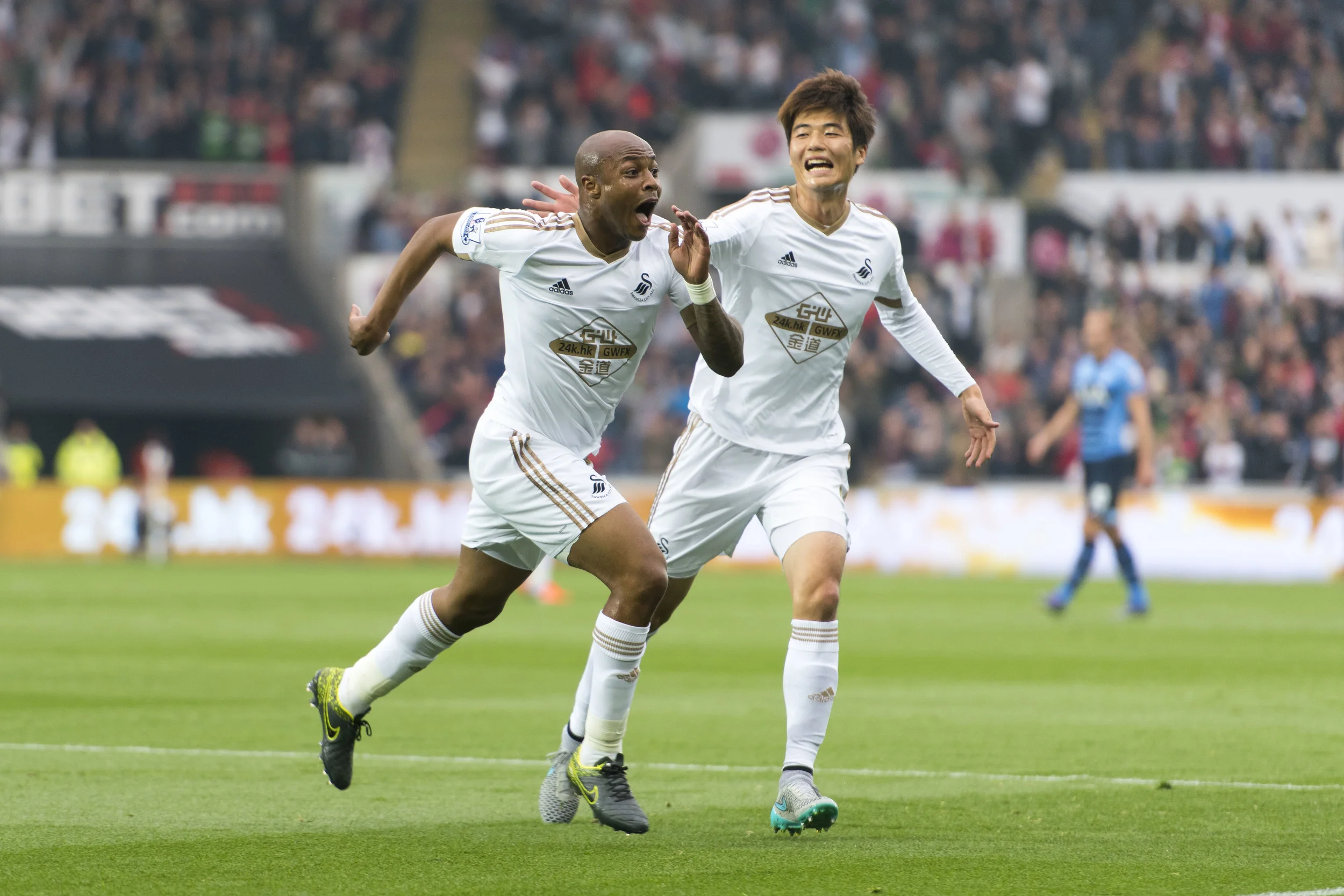 Swansea v Tottenham Hotspur Barclays Premier League match at the Swansea City stadium. André Ayew (left) celebrates after he scores a goal for Swansea City.