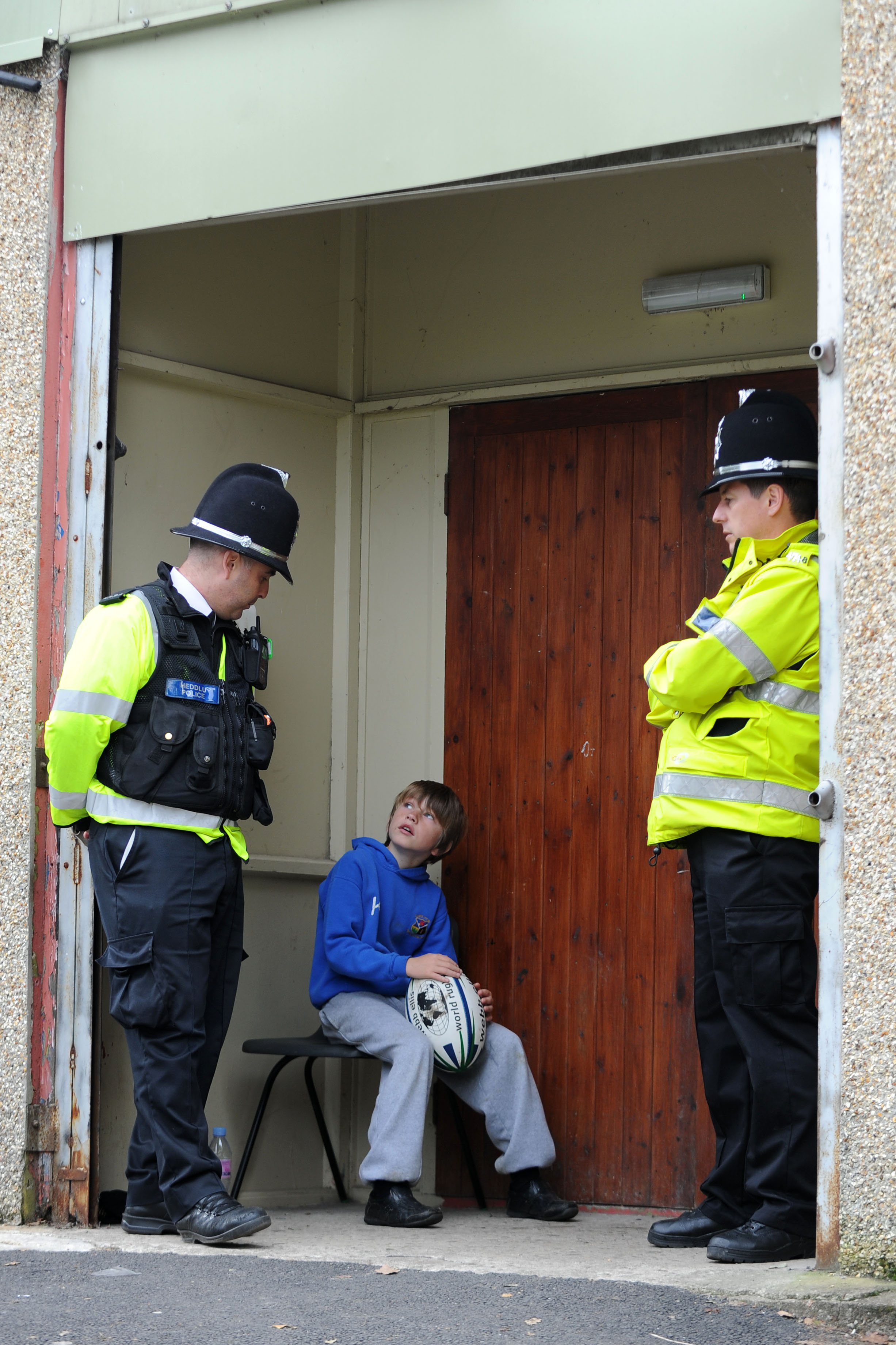  150911

One miner has died in the Gleision Colliery near Cilybebyll, Pontardawe. Yesterday the entrance to the mine became blocked by a flood.

Picture shows two policeman talking to a young boy at the community centre where friends and family are s