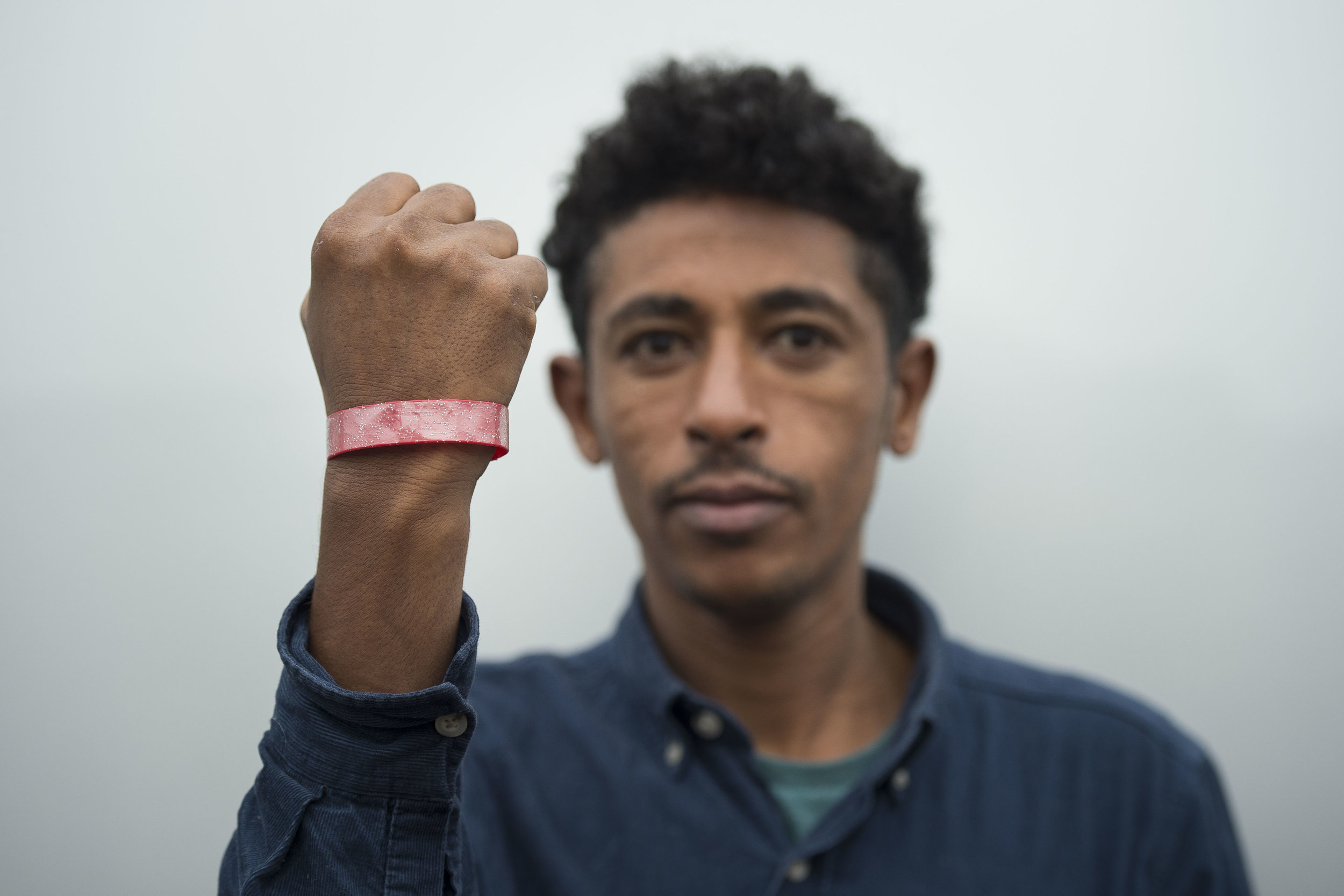 Asylum seekers staying at Lynx House on Newport Road in Cardiff, South Wales, have been given brightly coloured wrist bands to wear in order to claim food.

Picture shows Zekaryas Eyob of Eritrea who was made to wear a wrist band.

PIC Matthew Horwo