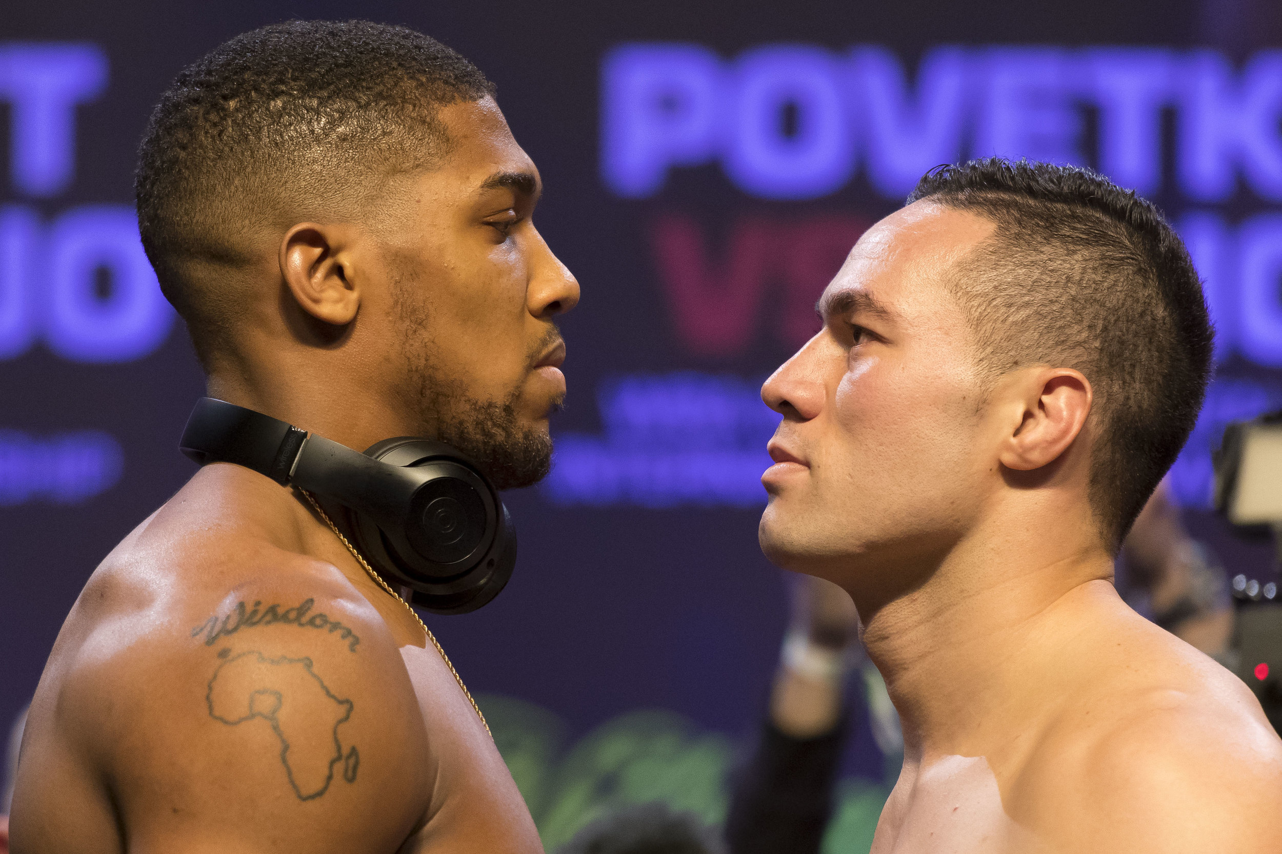  CARDIFF, WALES - MARCH 30: Anthony Joshua (L) and Joseph Parker (R) weigh-in at the Motorpoint Arena on March 30, 2018 in Cardiff, Wales. Anthony Joshua will fight Joseph Parker in a heavyweight unification match at the Principality Stadium in Cardi