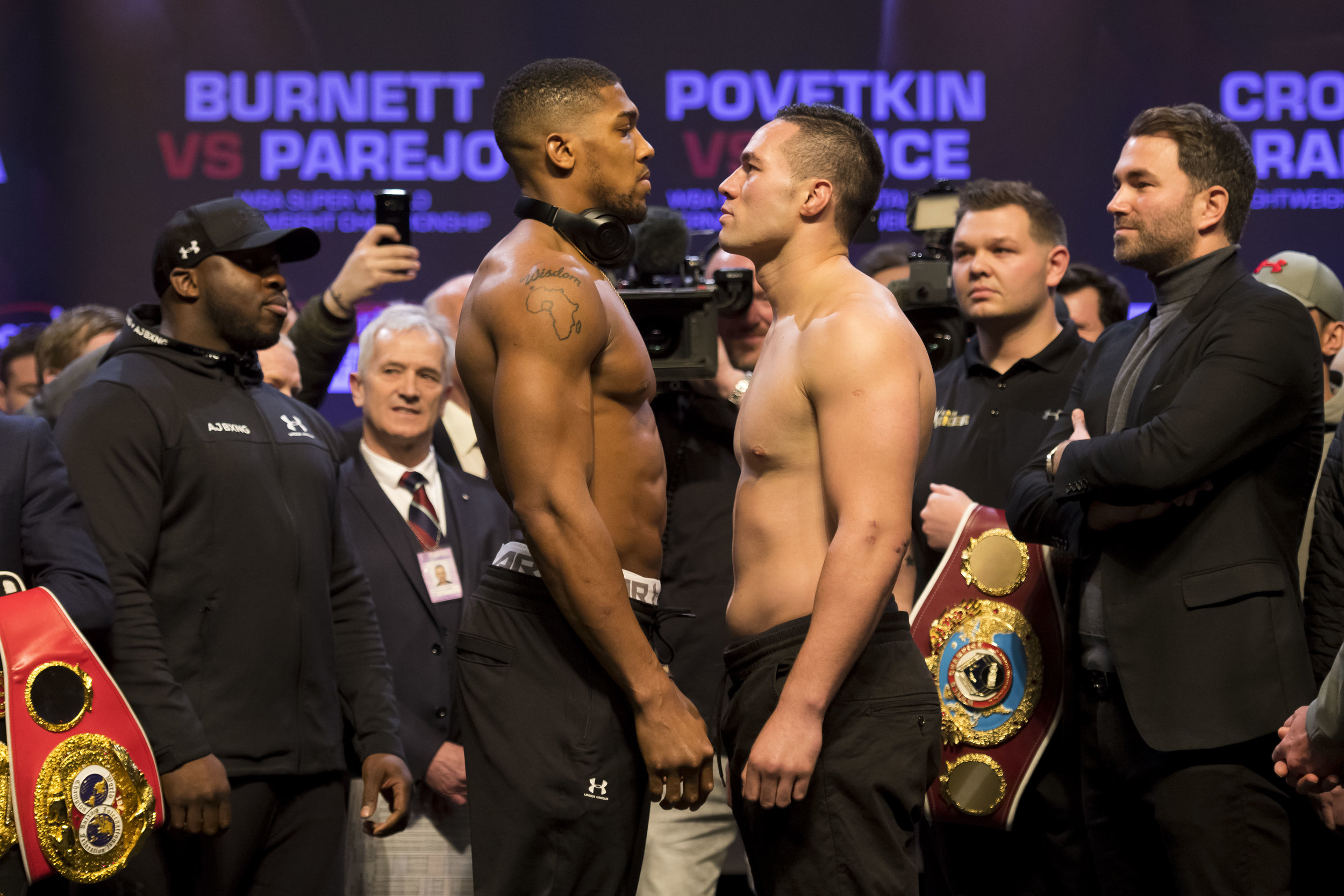  CARDIFF, WALES - MARCH 30: Anthony Joshua (L) and Joseph Parker (R) weigh-in at the Motorpoint Arena on March 30, 2018 in Cardiff, Wales. Anthony Joshua will fight Joseph Parker in a heavyweight unification match at the Principality Stadium in Cardi