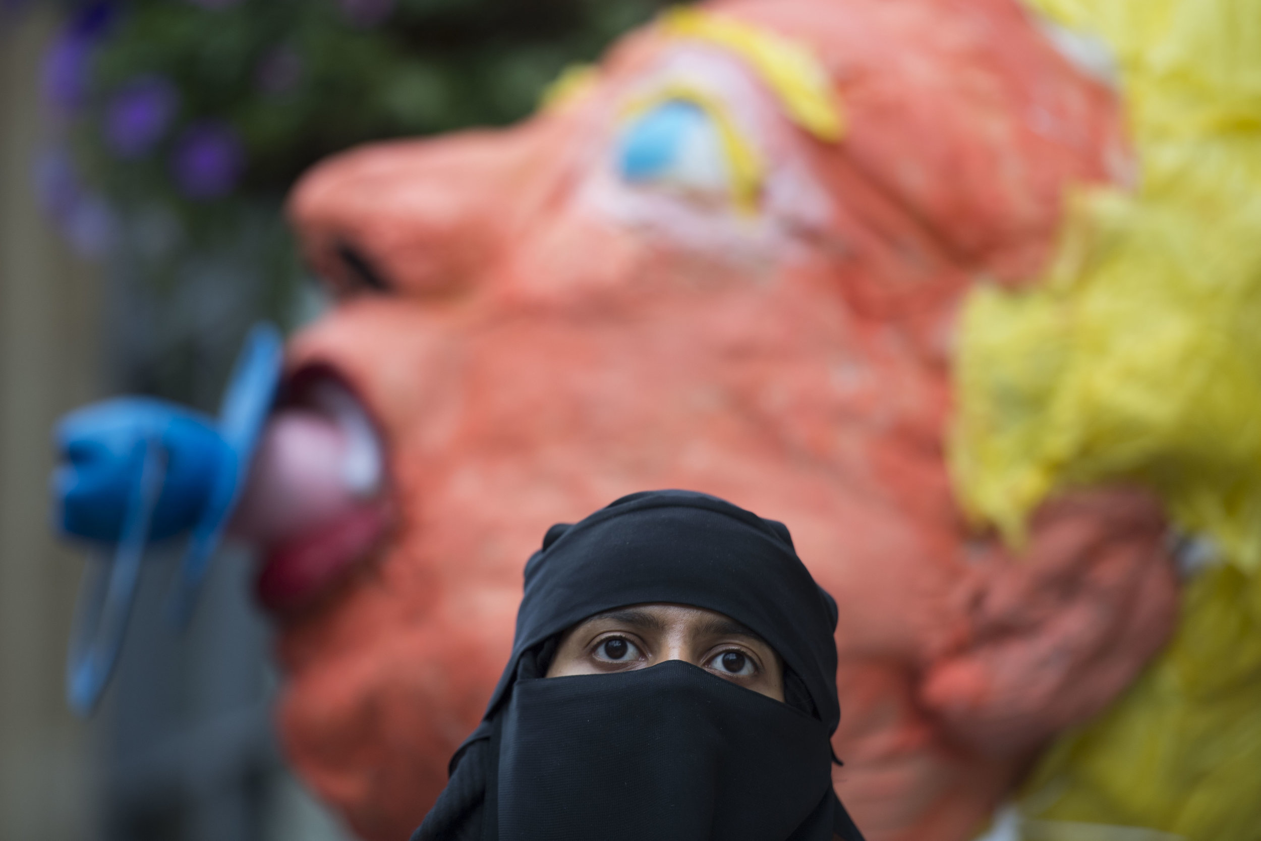  CARDIFF, UNITED KINGDOM - JULY 12: Sahar Al-Faifi stands in front of a giant Donald Trump model on Queen Street in Cardiff while protesting against a visit by the President of the United States Donald Trump on July 12, 2018 in Cardiff, United Kingdo