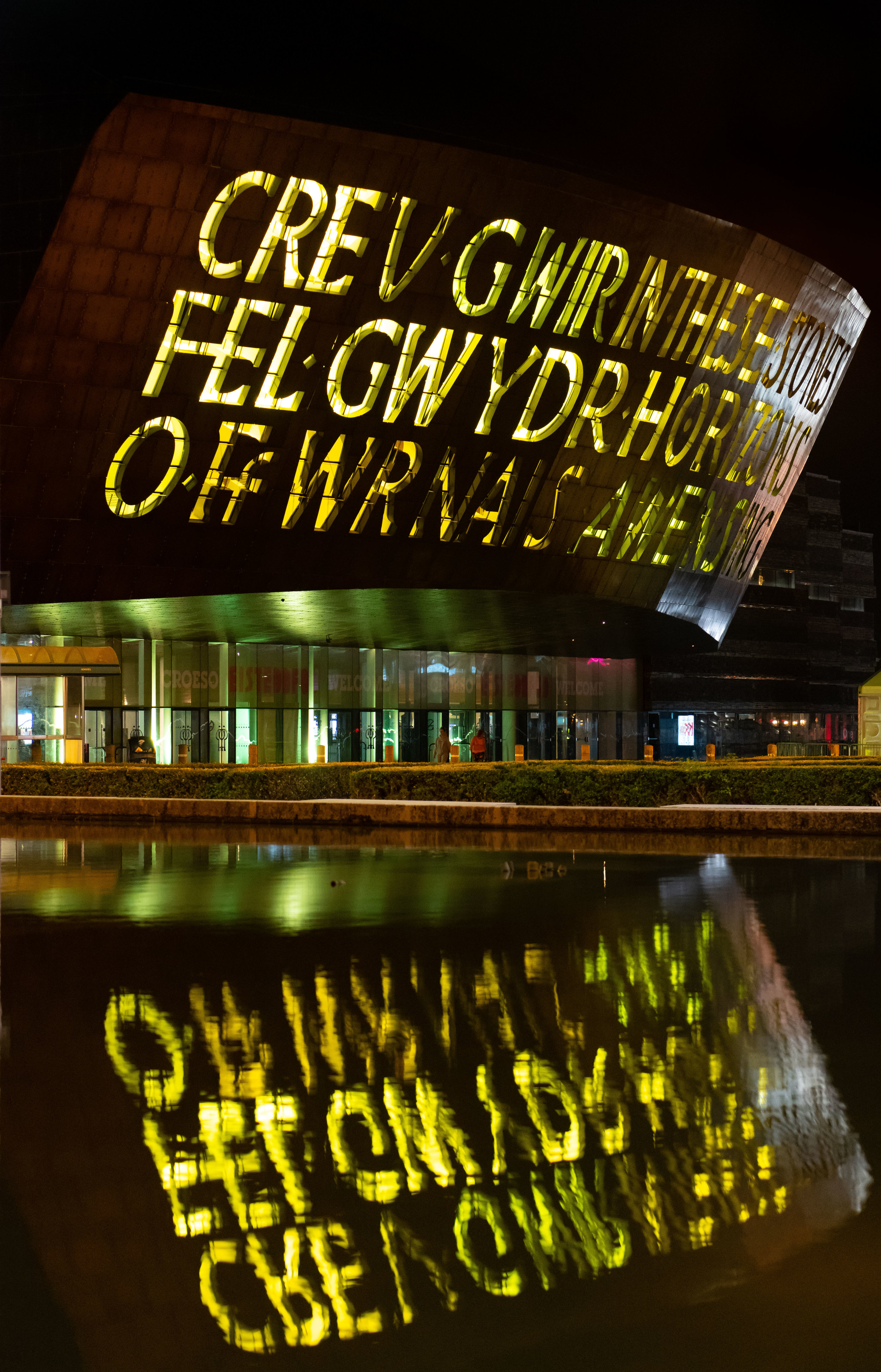  CARDIFF, WALES - JULY 29: The Wales Millennium Centre, Wales' national centre for performing arts, is seen illuminated in yellow light following cyclist Geraint Thomas' victory in the Tour De France on July 29, 2018 in Cardiff, Wales. Team Sky's Ger