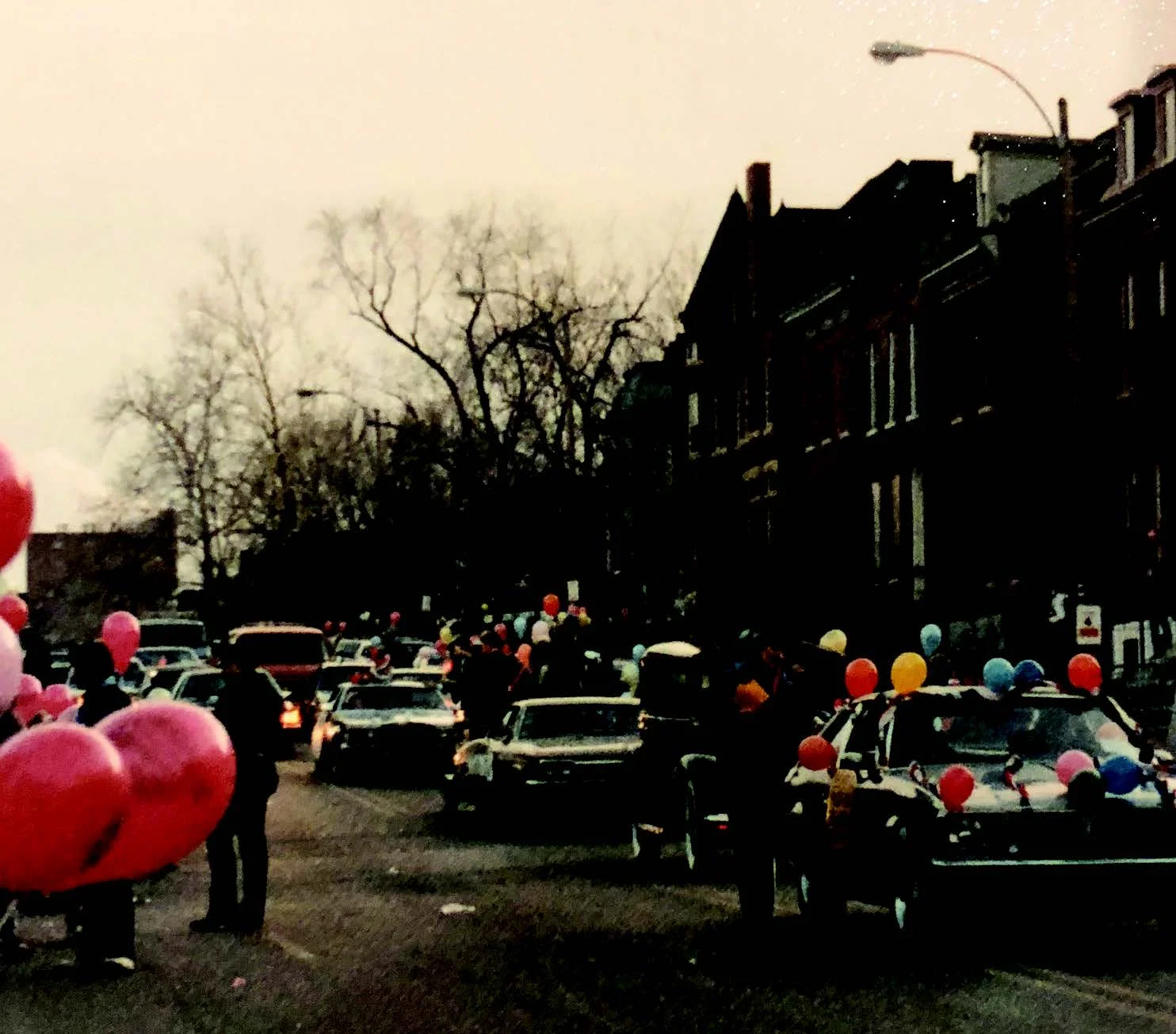 Circa 1985 mardi gras parade traveling northbound on 12th street at sunset.