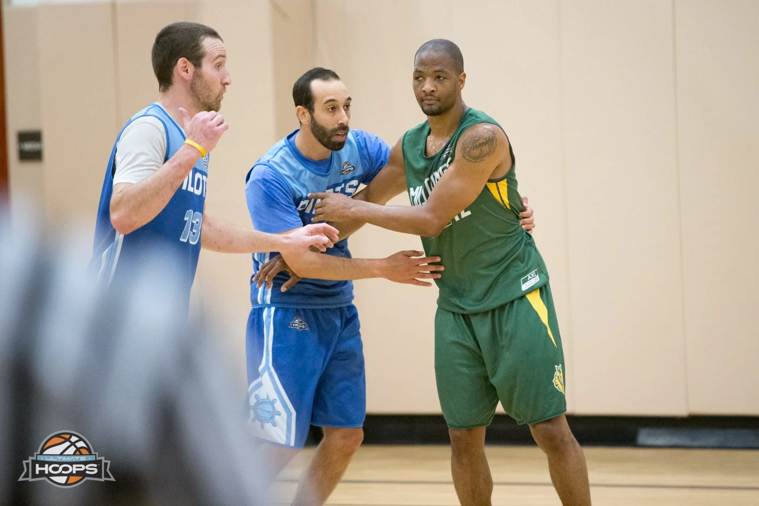 Joe Suek (13), Izzy Elkaffas and Paris Kyles (green jersey)