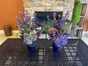 Lincolnway Flower Shop- Shades of purples in blue swirl vase