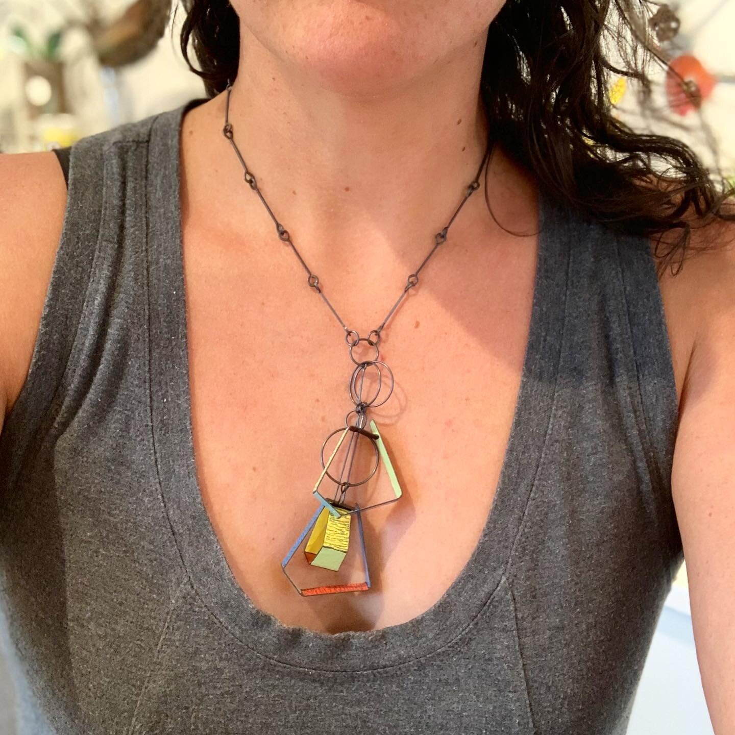 So fun to try on this funky geometric necklace by Mary and Lou Ann! It makes such a difference to see a piece on, especially when it has this much dimension. 
.
.
.
#handcraftedjewelry #jewelrydesign #jewelry