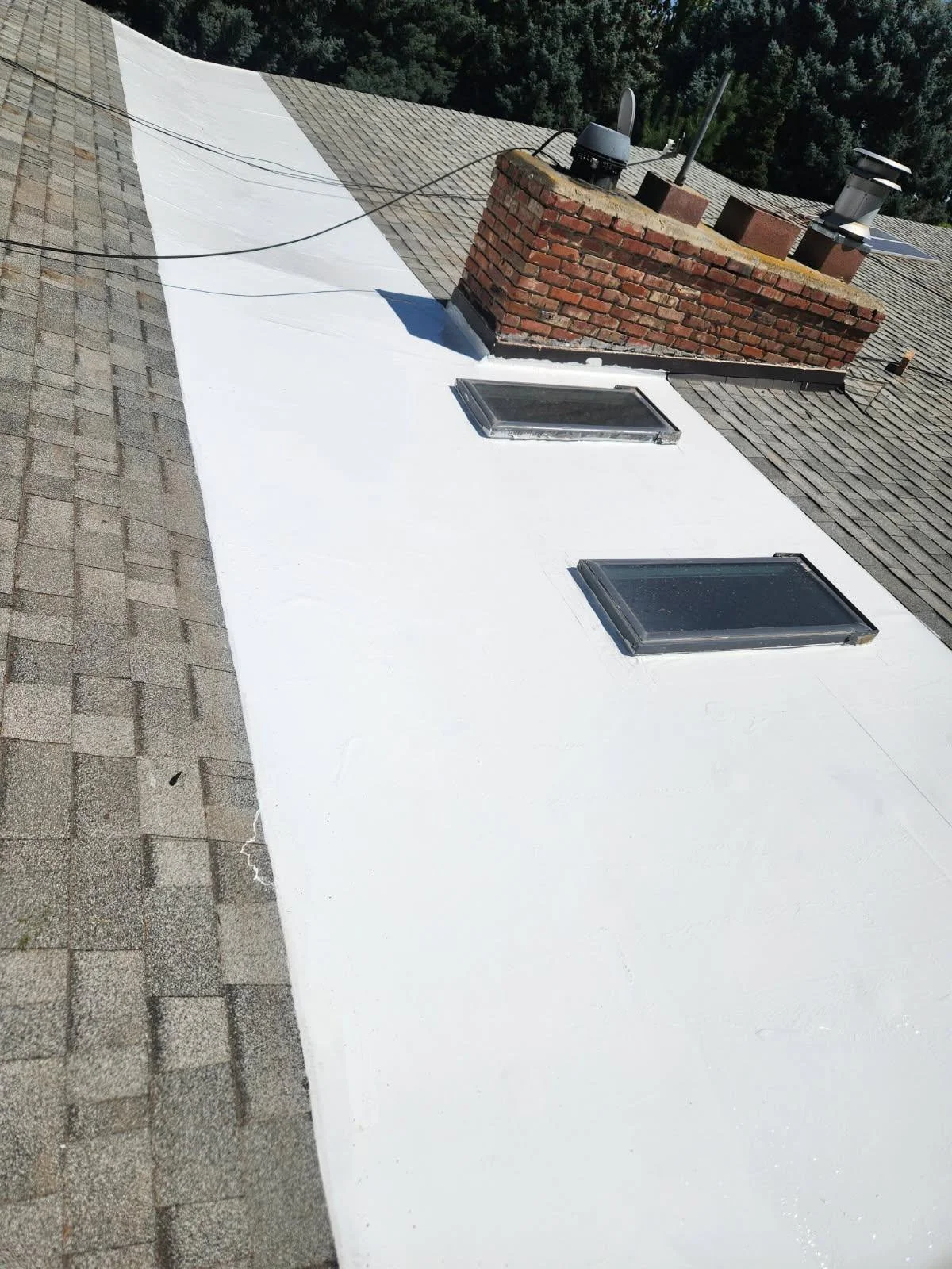 The same low-slope roof section after a new white reflective coating was installed, Kennewick, Washington