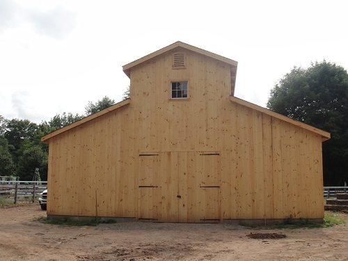finished animal barn before a fresh coat of paint