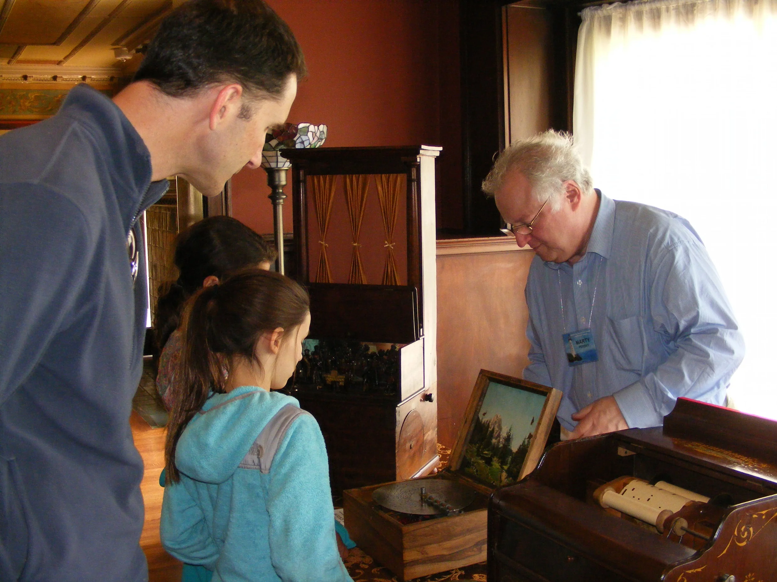 Demonstrating instruments for the public at the former residence of Herbert Mills of the Mills Novelty Company. 