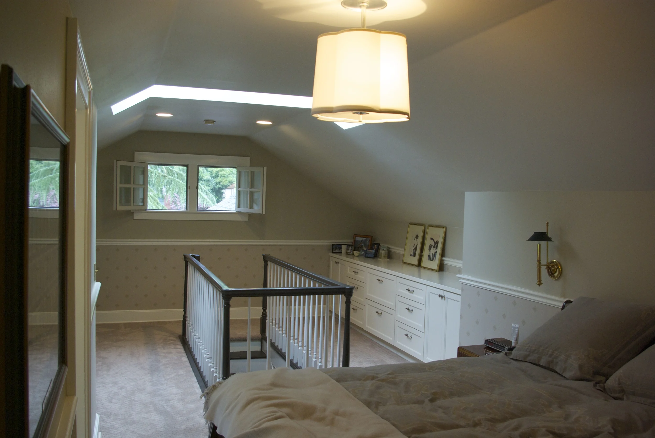 Face lift for loft-style master bedroom. New built in cabinets to provide accessible and clean storage. New carpet and paint to freshen up the room's feel.