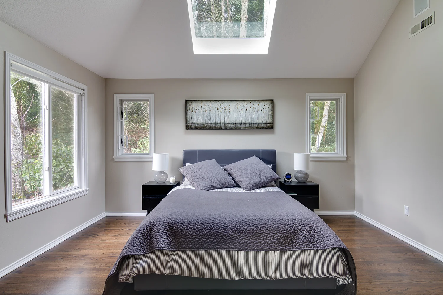 New hardwood floors, trim, and paint in master suite.